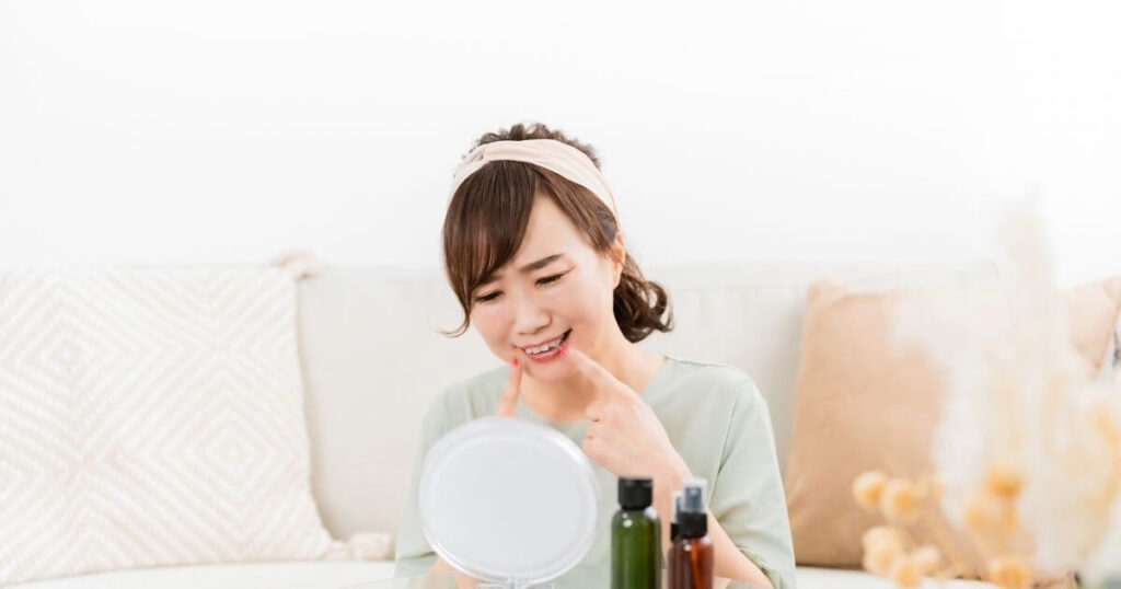 歯を見て悲しむ女性